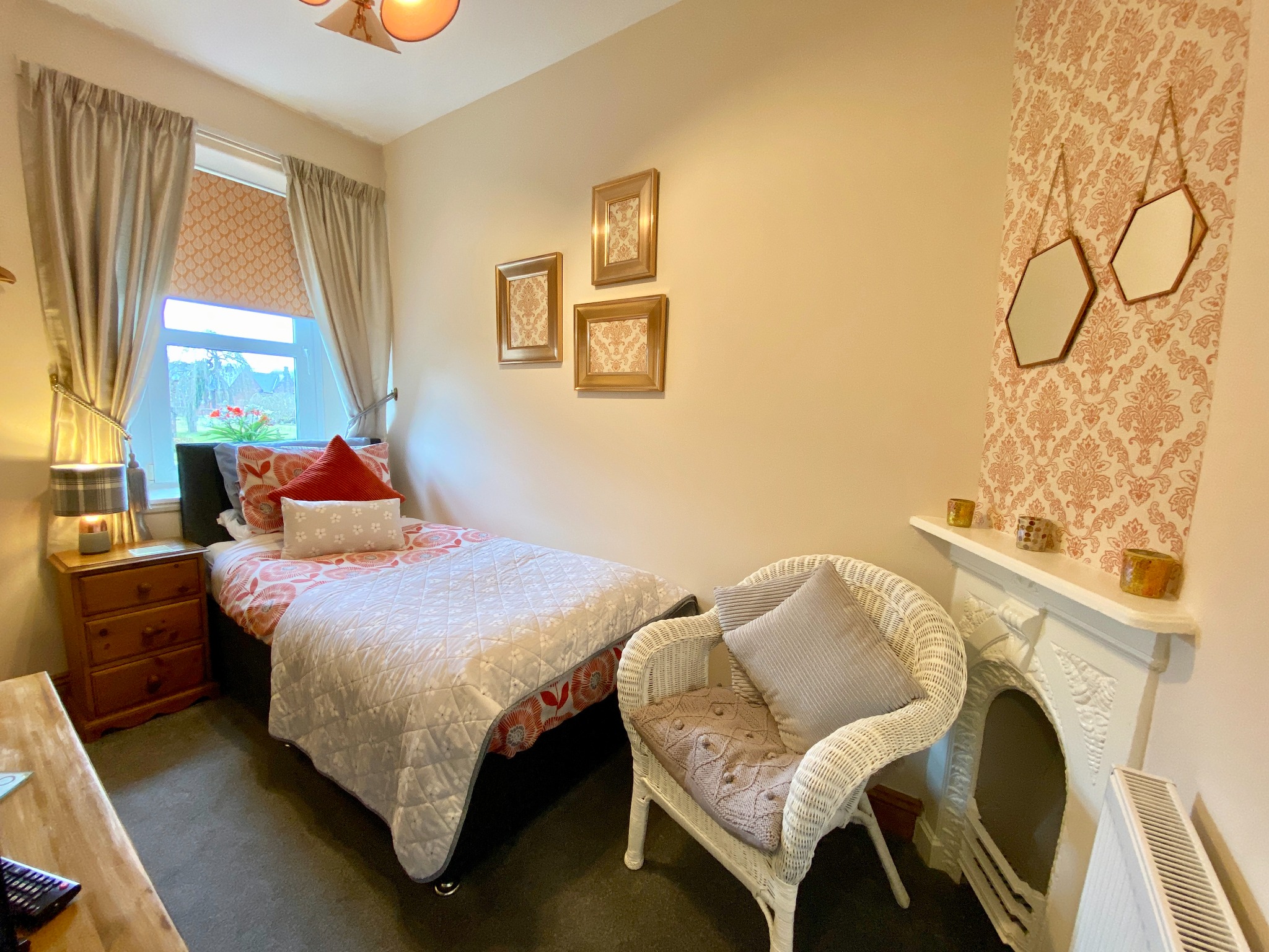 Coral single room with seating and fireplace