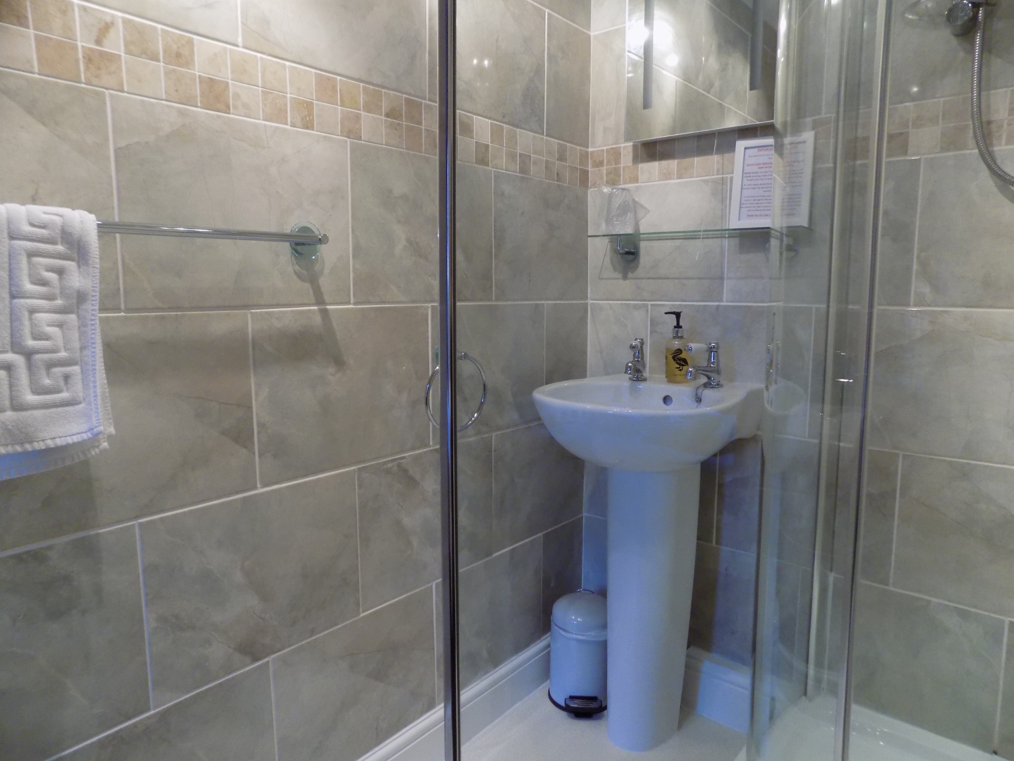 Bright tiled en-suite shower room
