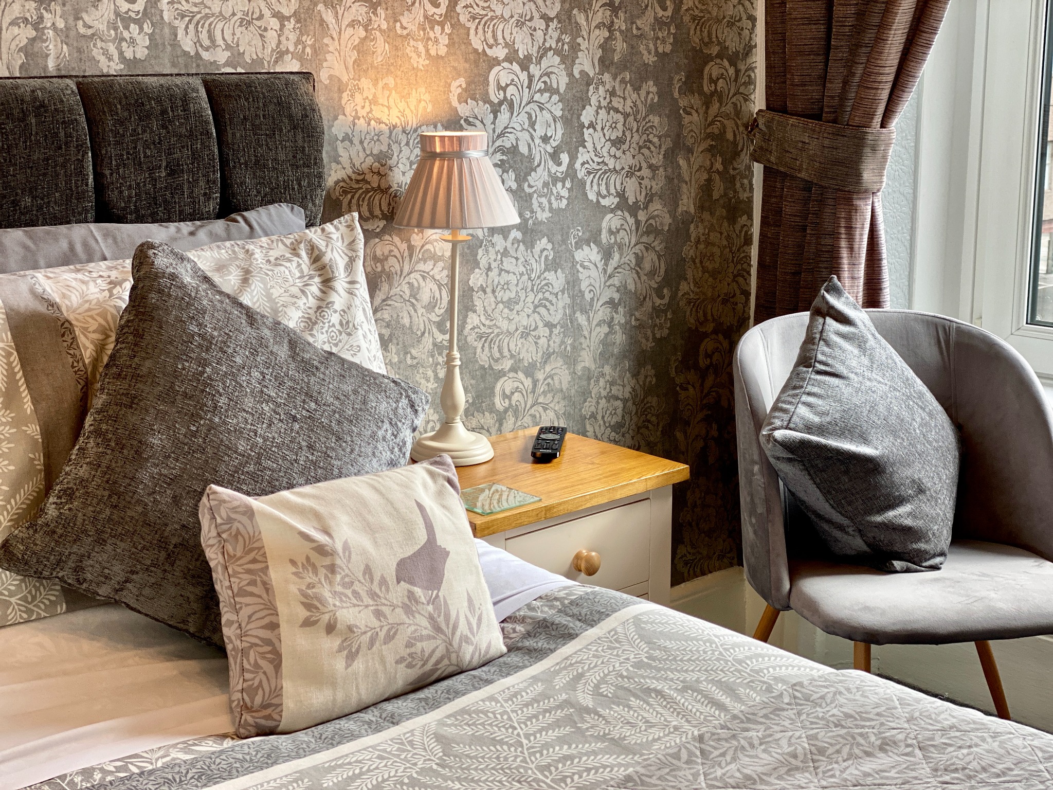 Grey bedroom soft furnishings and seating