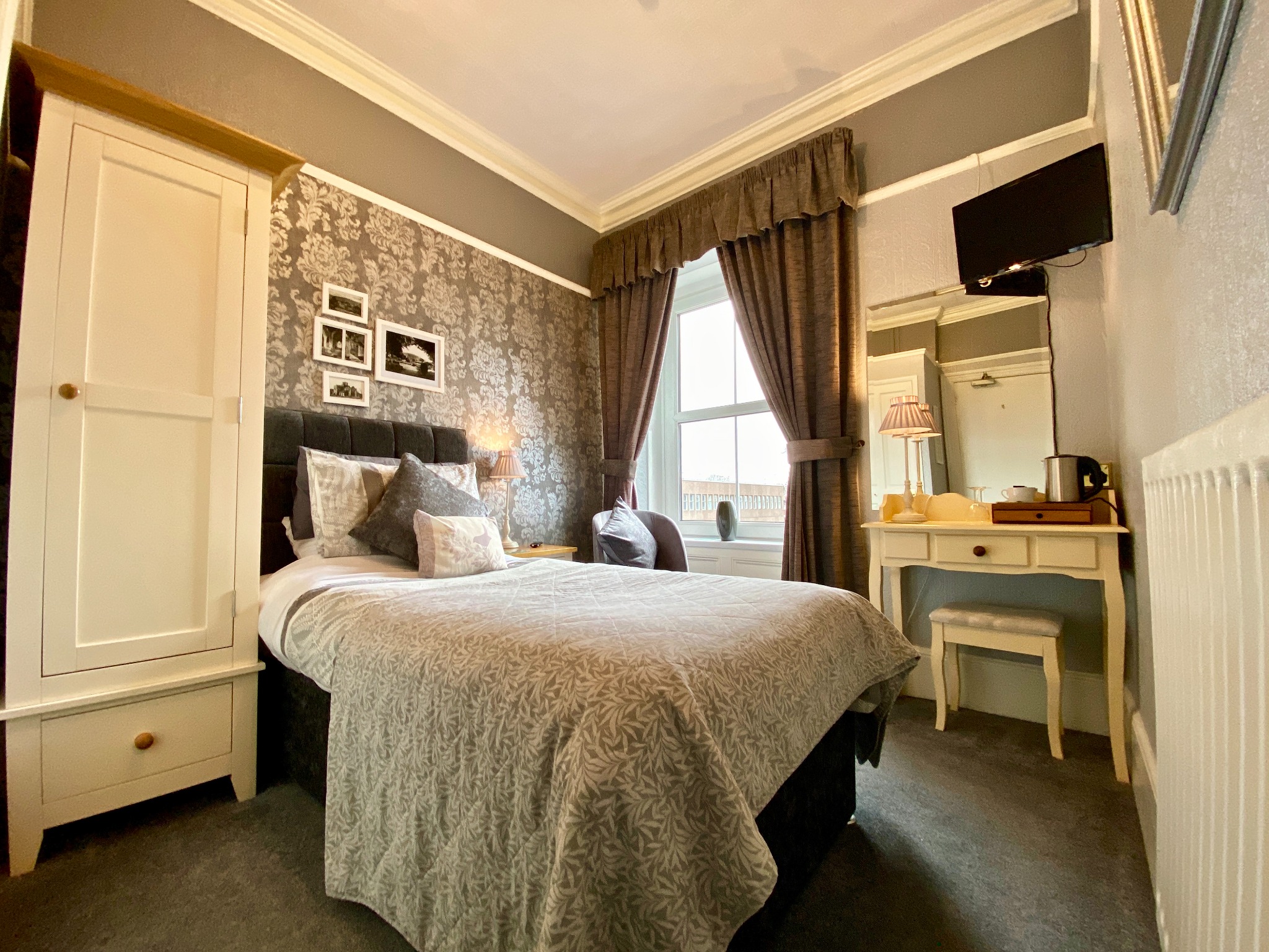 Grey guest bedroom at Glendale Guesthouse